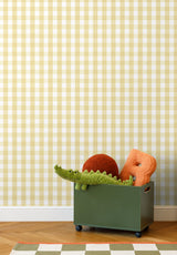 Grand Vichy wallpaper in Jaune in a children's bedroom with a toy crocodile