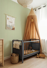 Petit Vichy wallpaper in Vert Olive in a children's bedroom