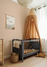 Petit Vichy wallpaper in Terracotta Doux in a children's bedroom