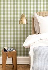 Grand Vichy wallpaper in Vert Olive in a bedroom